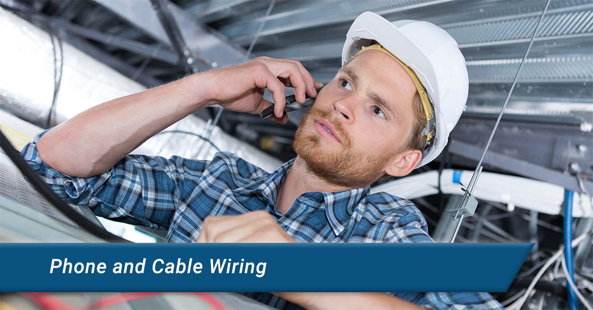 man installing phone cable wiring